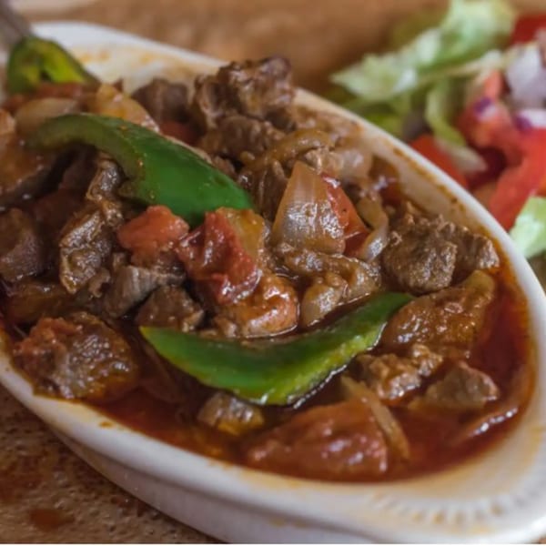 Messob Ethiopian Restaurant's tibs, a dish of beef, green peppers, and onions in a rich sauce.
